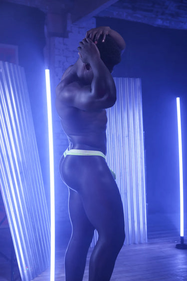 Fashionable presentation of Sukrew Men's Sheer Low-Rise Thong in Acid Yellow, featuring a stylish jacquard branded waistband and spectacular softness. A top-tier men's thong for modern gents.